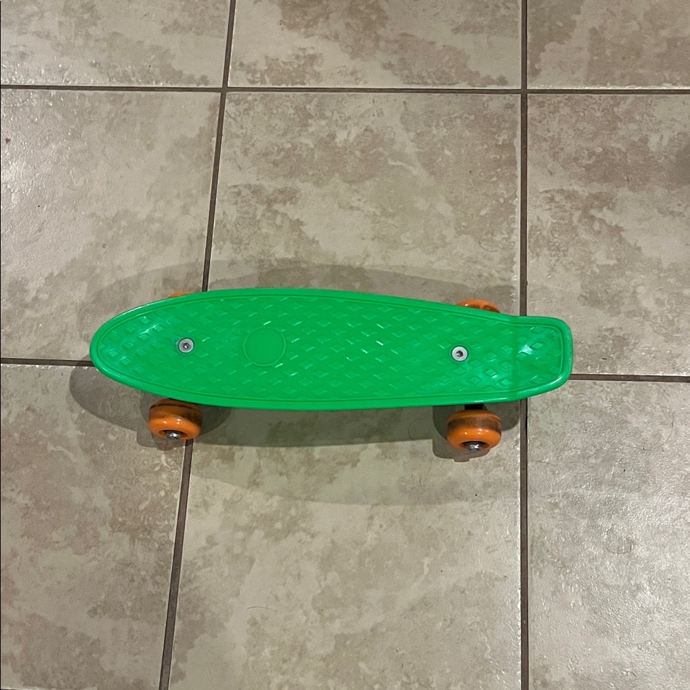 Vibrant Green Kids Skateboard with Orange Wheels